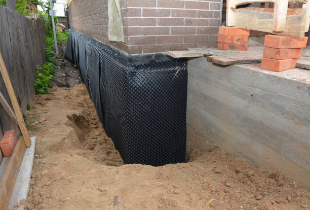 Happy homeowners after waterproofing job in Onsted